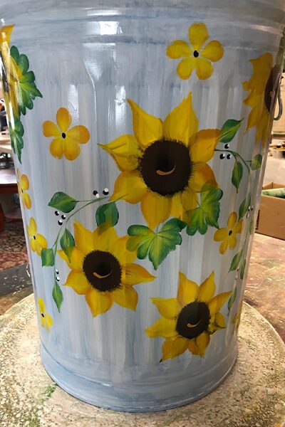 20 Gallon Light Blue wash with greenery and sunflowers with filler flowers