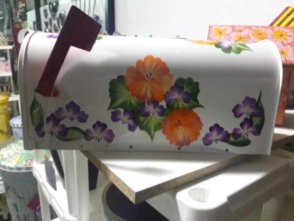 Mailbox Bright white with orange, yellow, purple floral. The Painted Can
