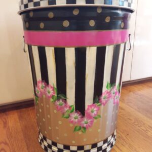 A can with black and white pattern and pink flowers