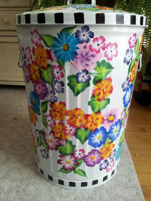 A black and white can with colorful flowers