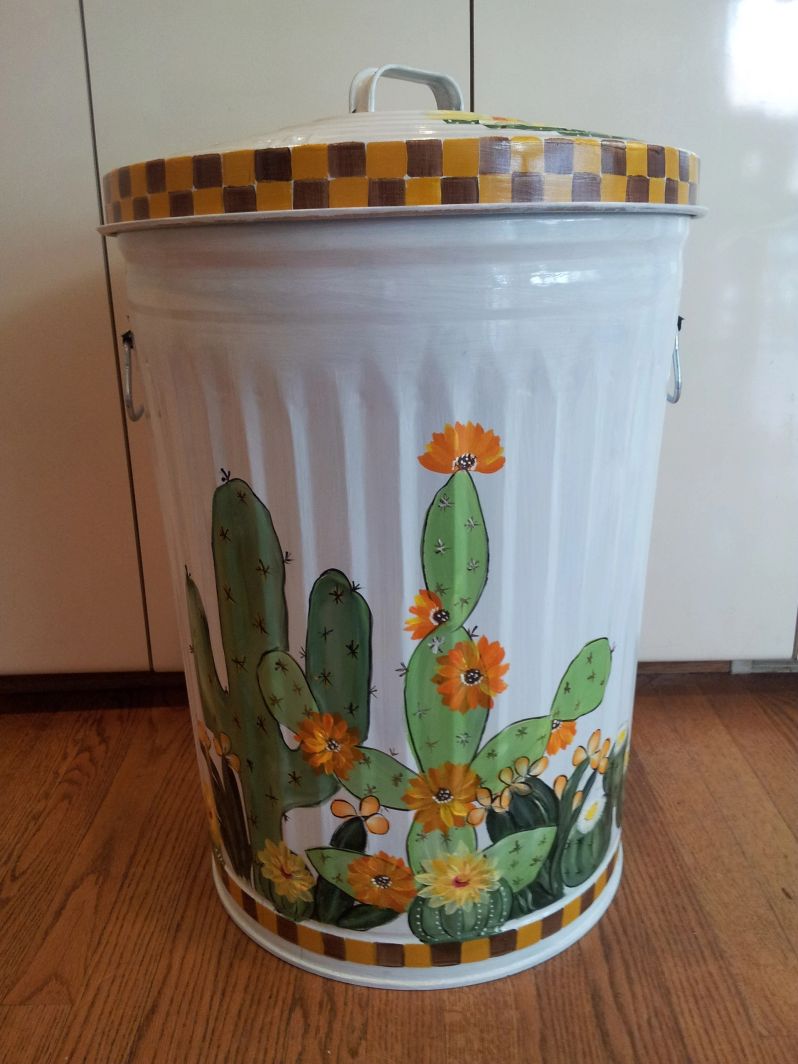 20 Gallon bright white with cactus, yellow, white, orange flowers. The Painted Can