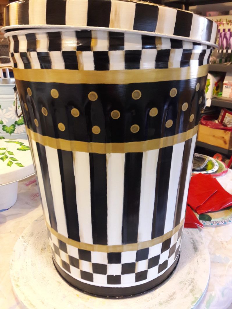 20 gallon black and cream check and stripes with gold banding. The Painted Can