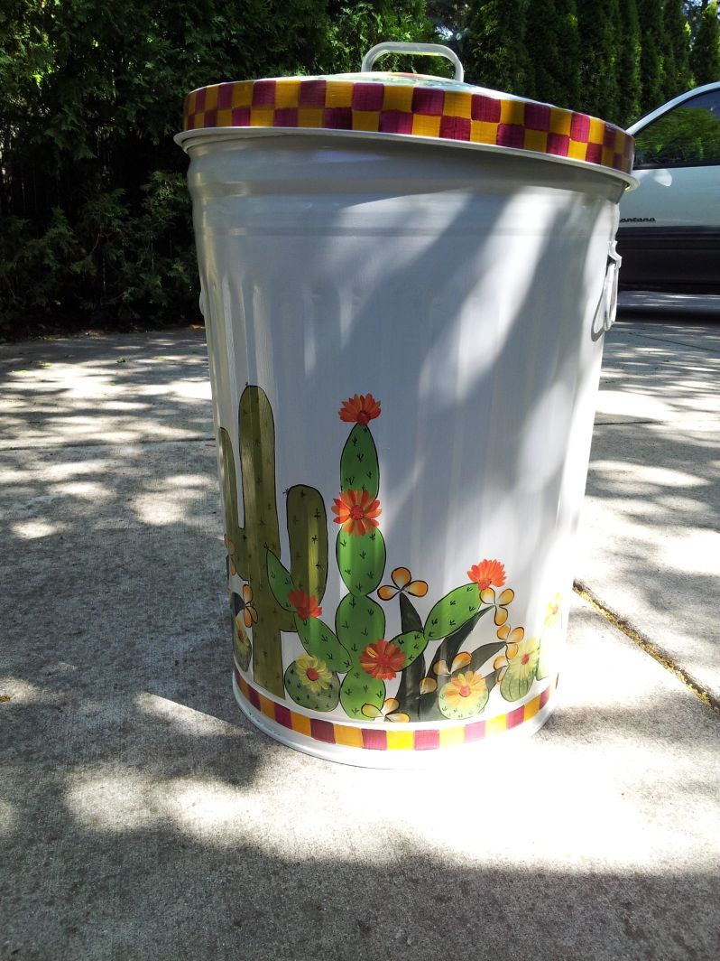 30 Gallon bright white with cactus, yellow, white, orange flowers. The Painted Can