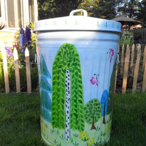 A tall can with a garden-themed paint and pink butterfly designs