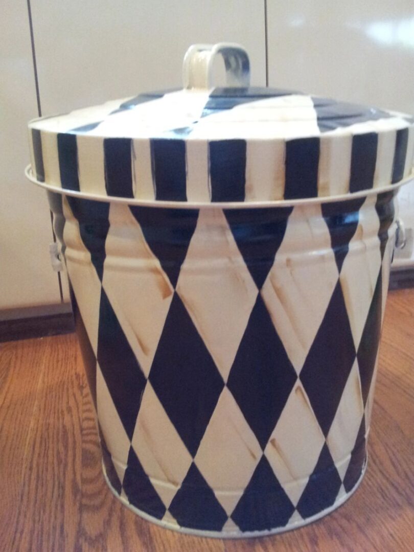 A black and white can with diagonal patterns