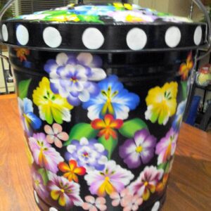 A black can with huge white polka dots and colorful flowers