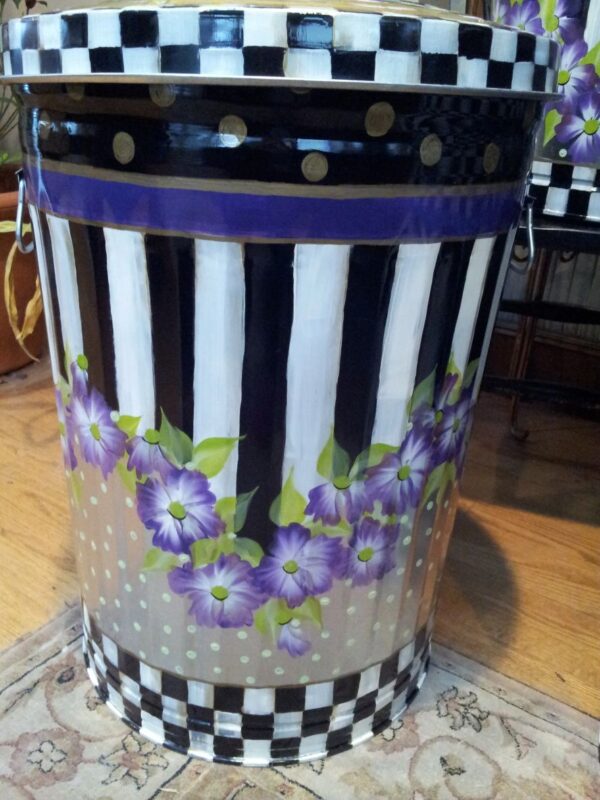 A can with black and white pattern and purple flowers