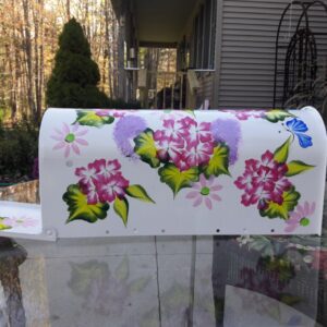 Mailbox Bright white with fuchsia floral, greenery, cobalt butterflies. The Painted Can