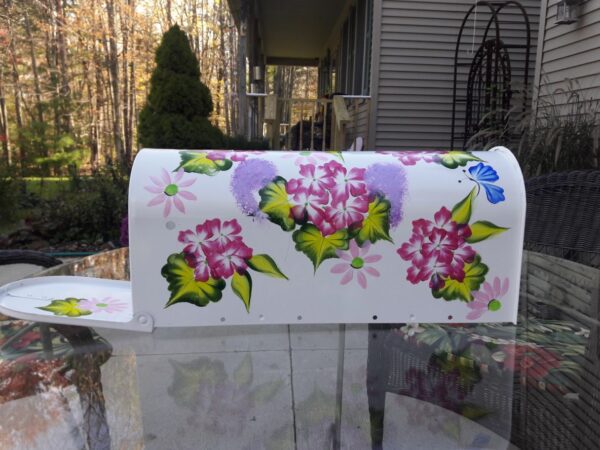 Mailbox Bright white with fuchsia floral, greenery, cobalt butterflies. The Painted Can