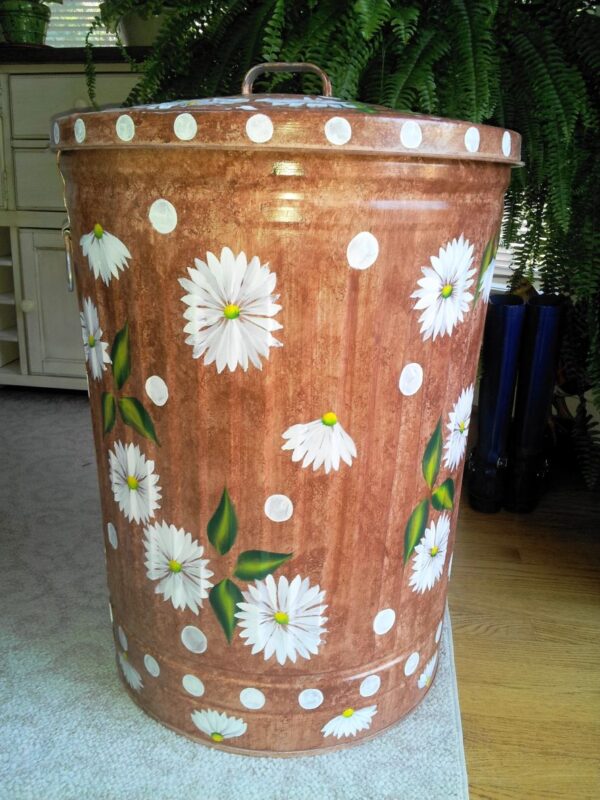 A brown can with white flowers and polka dots